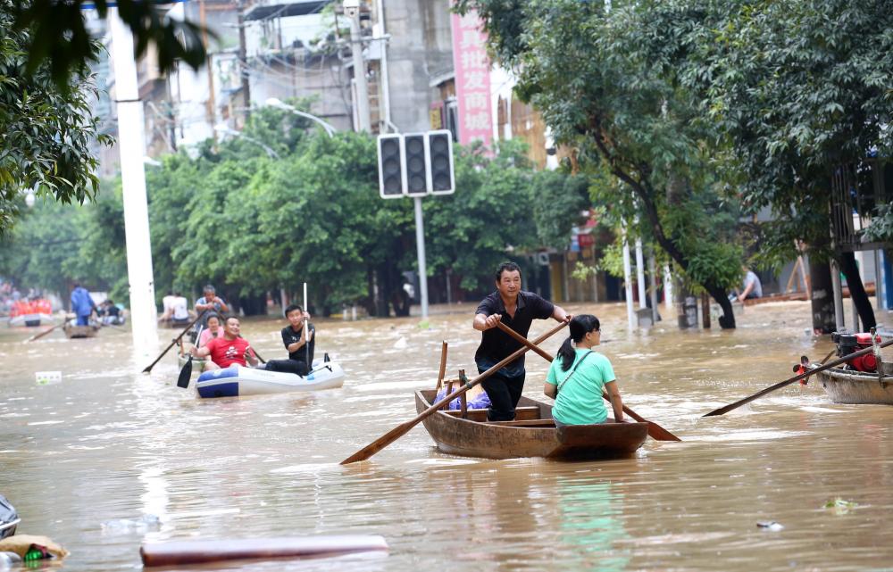 The Weekend Leader - 12 killed, thousands evacuated as floods ravage China